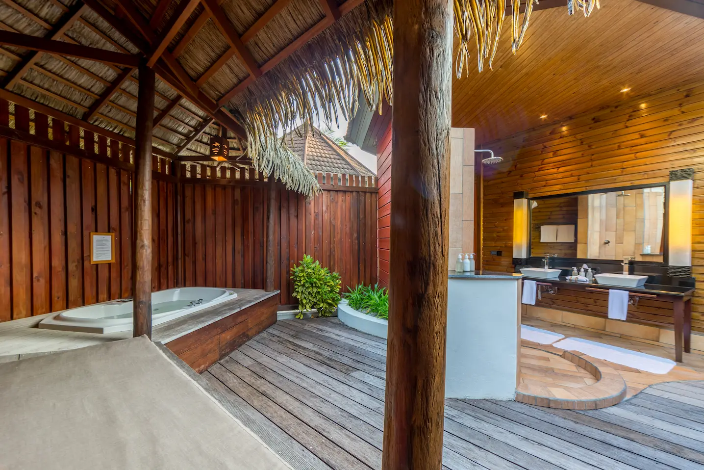 komandoo maldives jacuzzi beach villa bathroom sink featuring elegant island luxury detailing