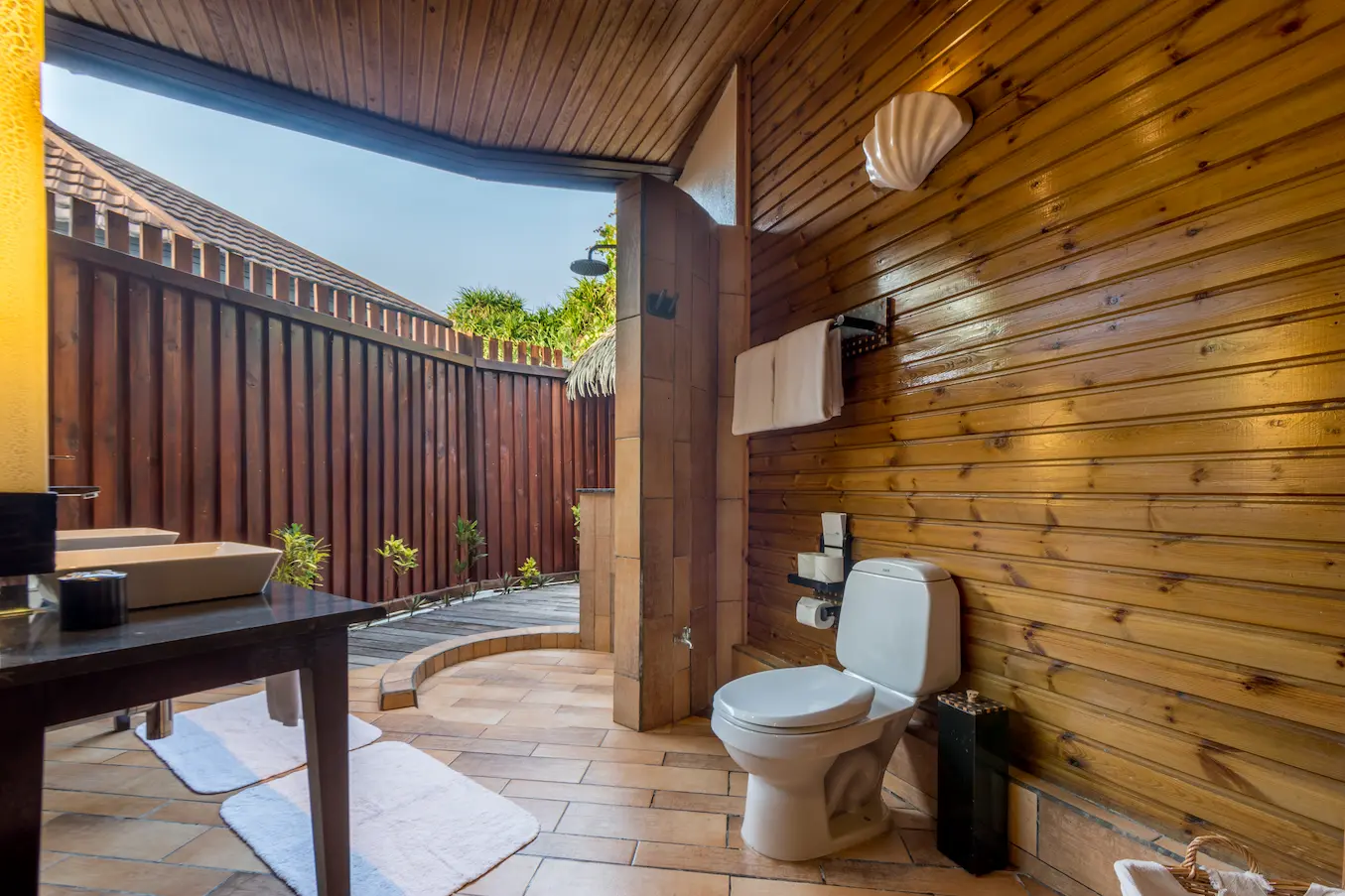 komandoo maldives jacuzzi beach villa bathroom toilet showcasing serene island luxury detailing