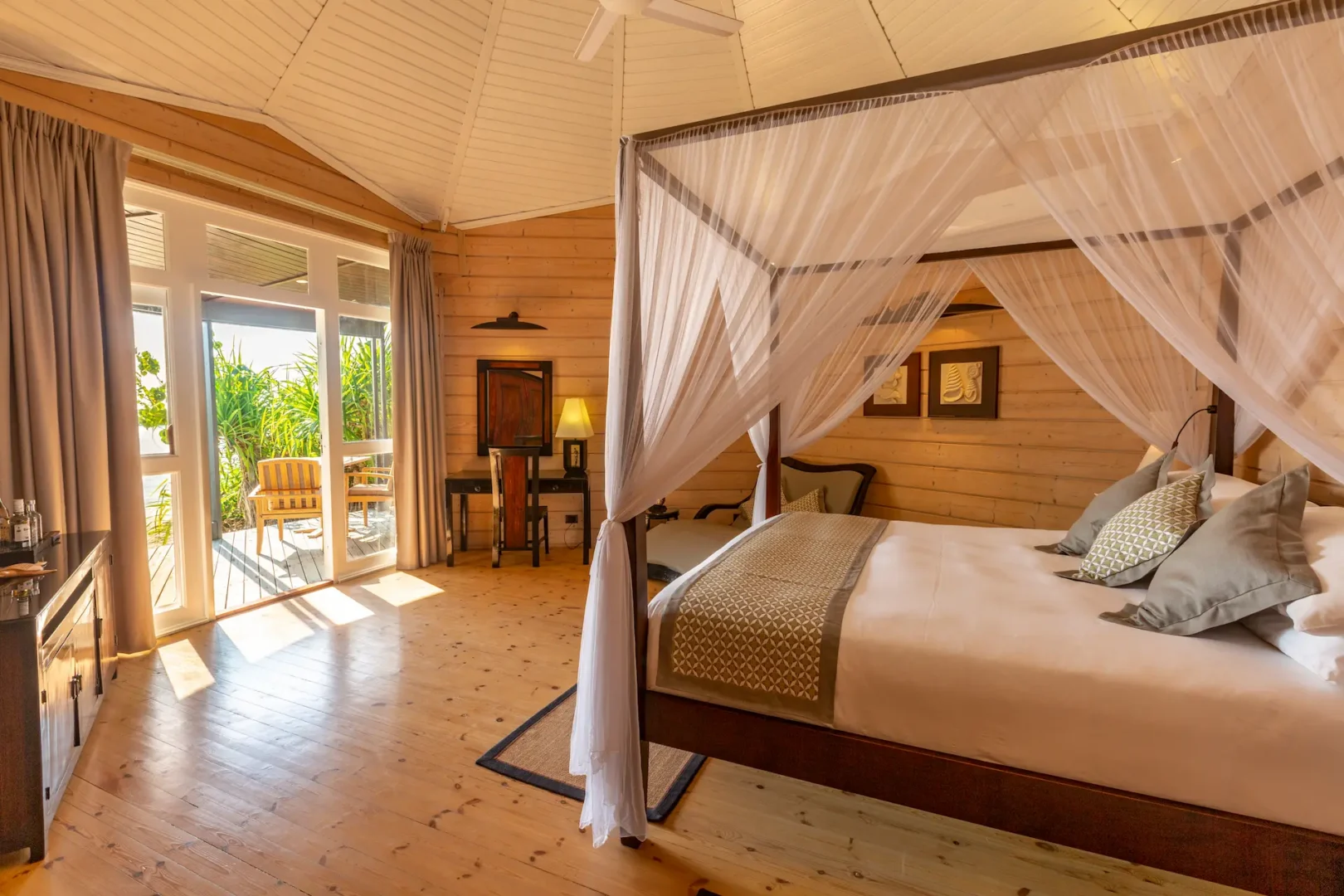 komandoo maldives jacuzzi beach villa interior bed showcasing serene island luxury and elegant tropical comfort
