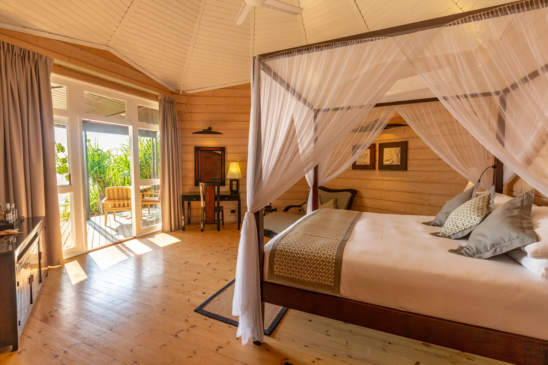 komandoo maldives jacuzzi beach villa interior bed showcasing serene island luxury and elegant tropical comfort