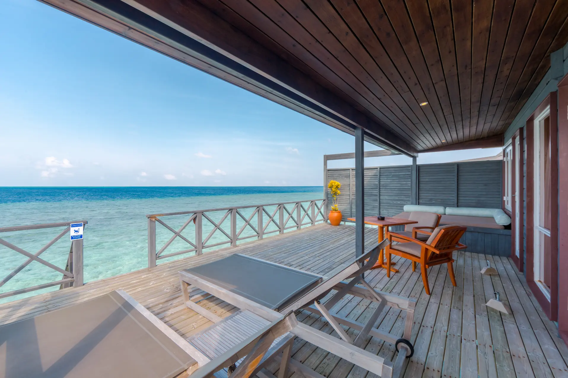 komandoo maldives jacuzzi water villa deck showcasing serene overwater luxury and tranquil ocean views
