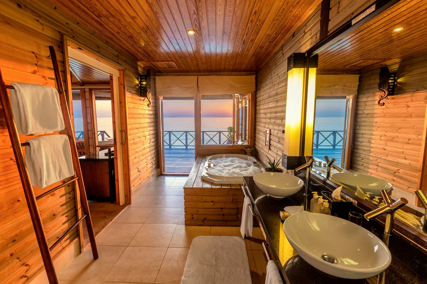 komandoo maldives ocean jacuzzi water villa bathroom jacuzzi bathtub showcasing serene overwater luxury and soothing lagoon ambience