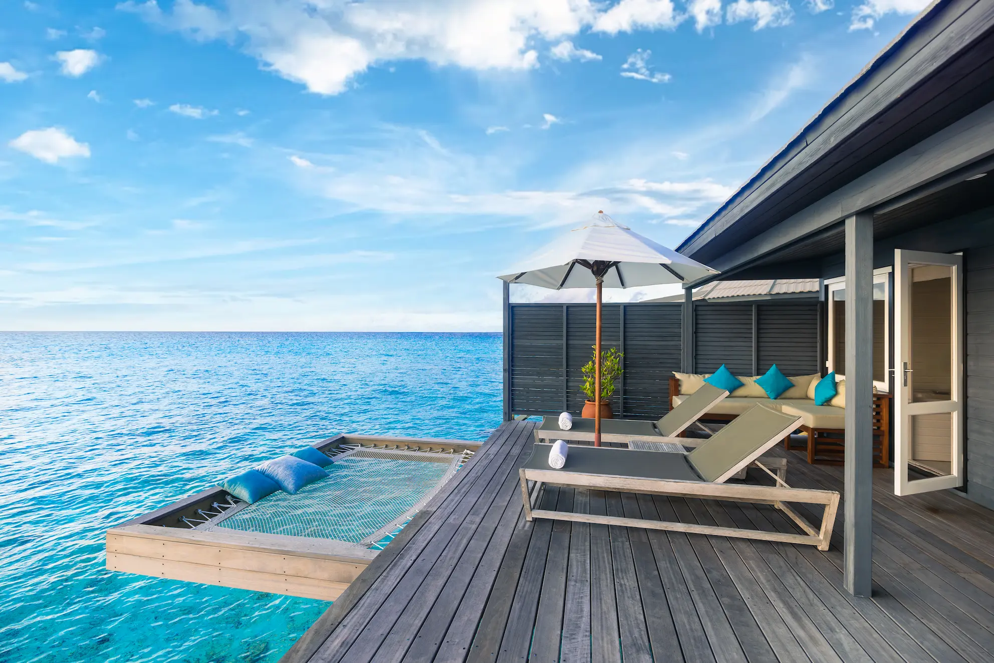 komandoo maldives ocean jacuzzi water villa terrace showcasing serene overwater luxury and panoramic lagoon views