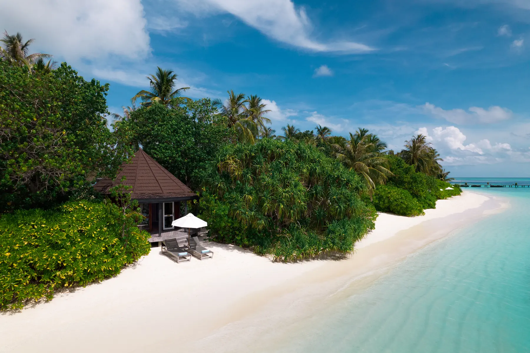 komandoo maldives premium jacuzzi beach villa exterior view showcasing tranquil island luxury and lagoonside serenity