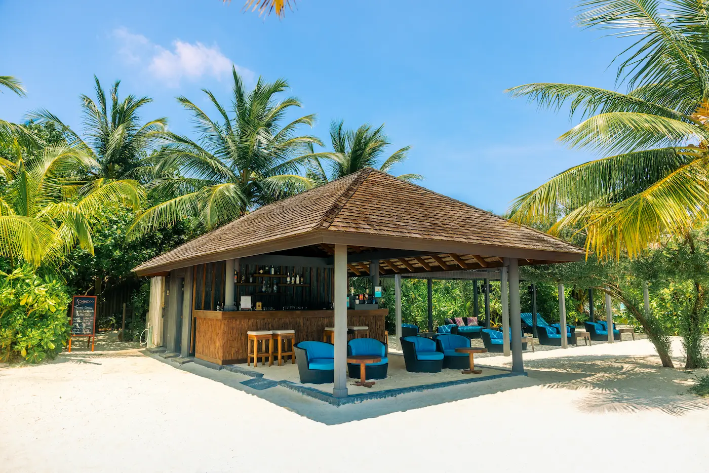komandoo maldives thundi bar showcasing relaxed island luxury and serene beachfront ambience