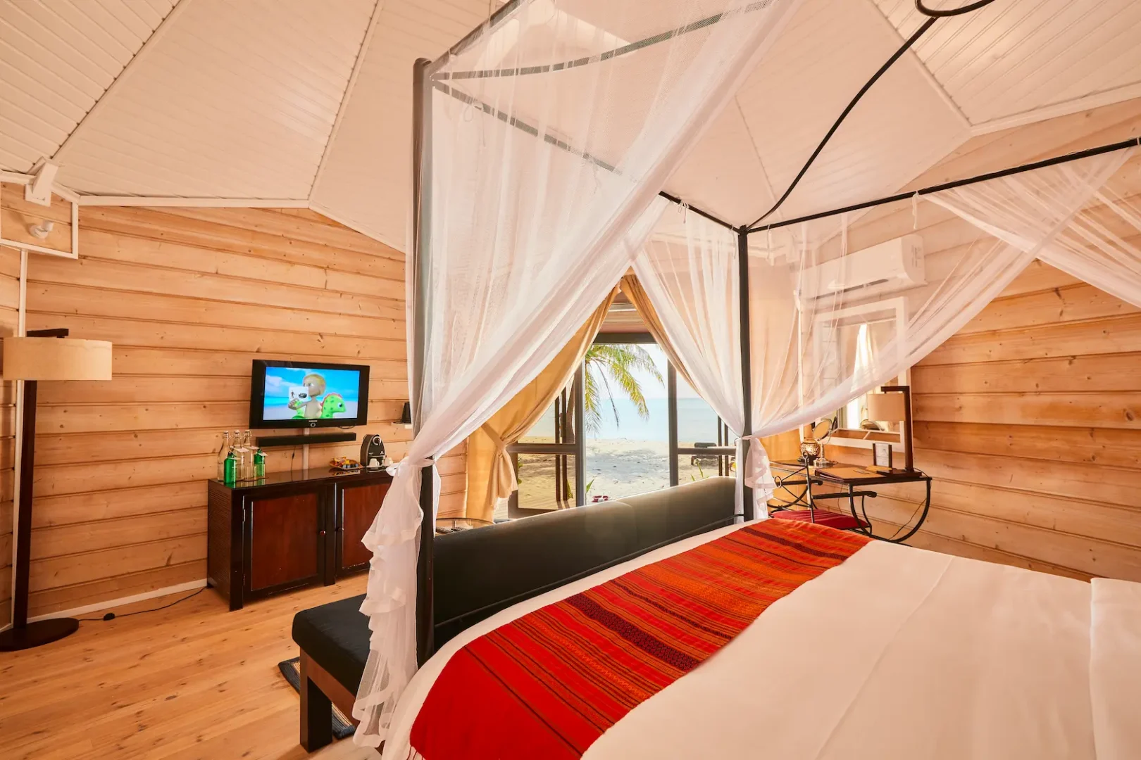 kuredu island resort & spa maldives jacuzzi beach villa interior bed with view