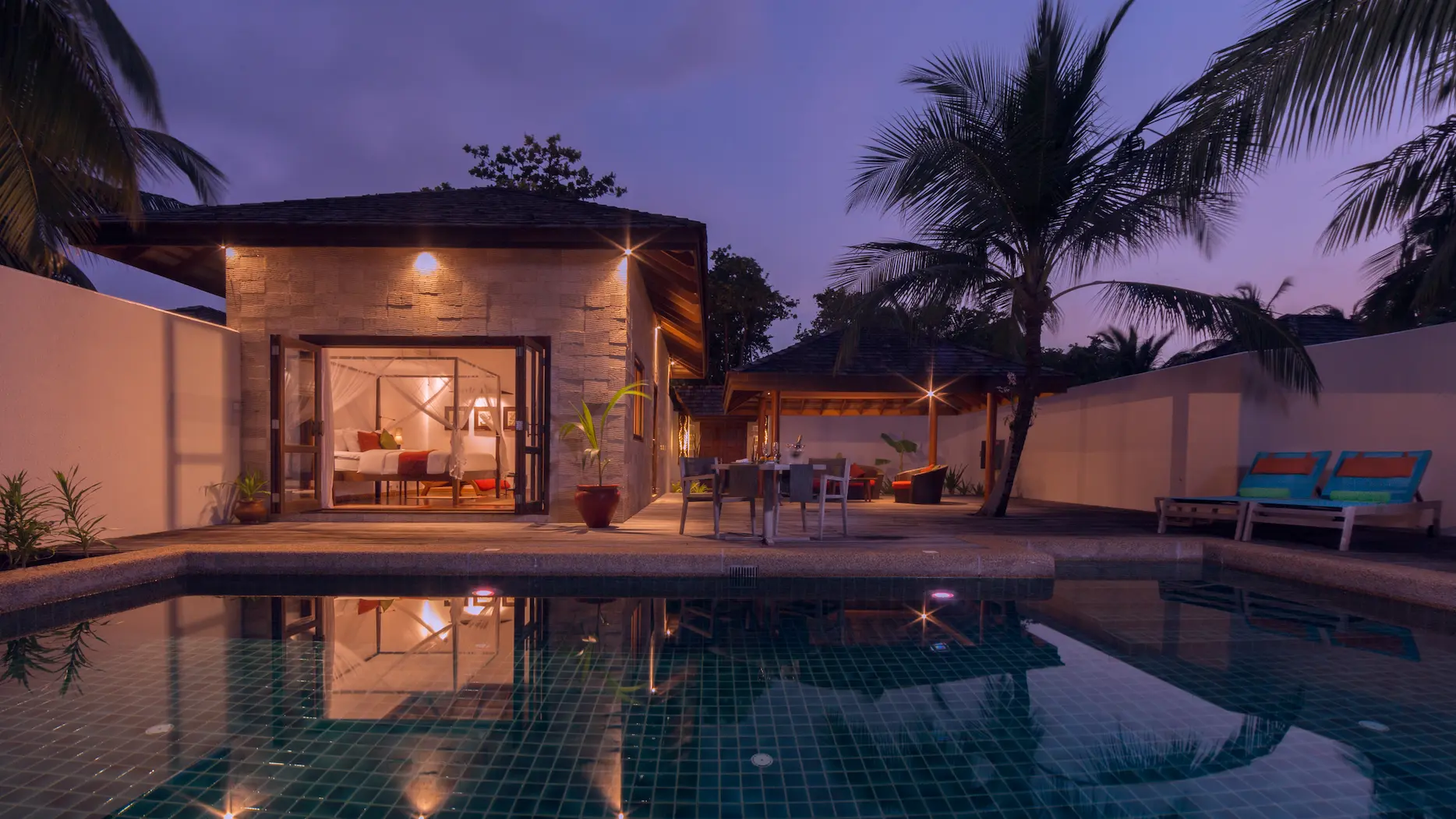 kuredu island resort & spa maldives private pool villa exterior at night