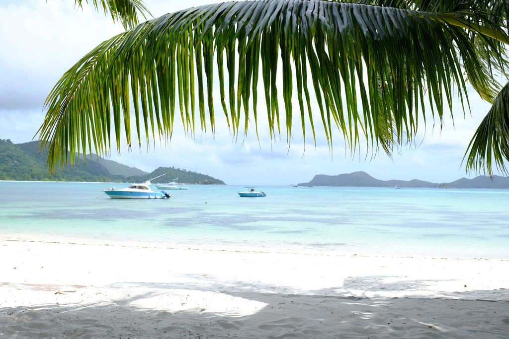 larchipel seychelles beach view with white sand turquoise water and tropical surroundings