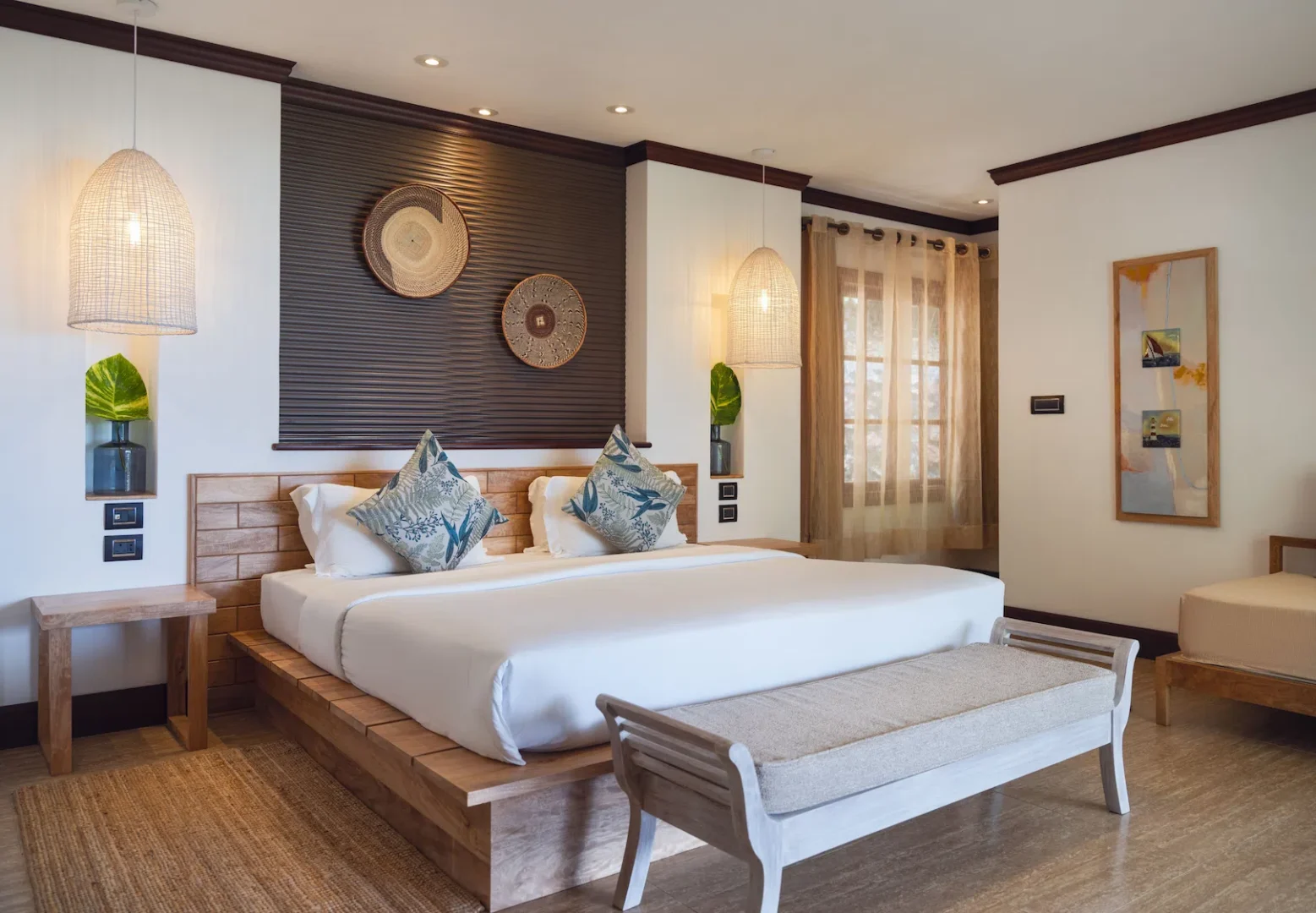 larchipel seychelles deluxe room bedroom with king bed and tropical balcony view