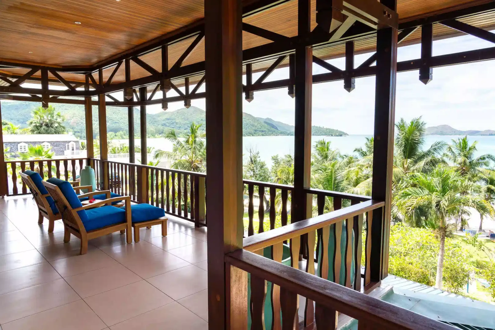 larchipel seychelles family suite balcony with seating area and tropical ocean view