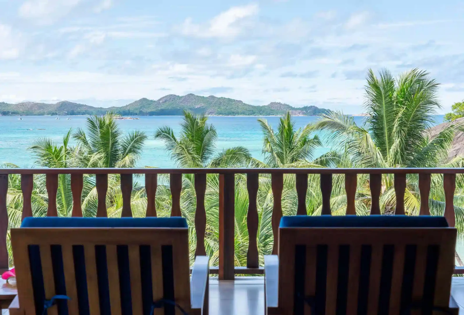 larchipel seychelles family suite balcony with chairs and tropical ocean view