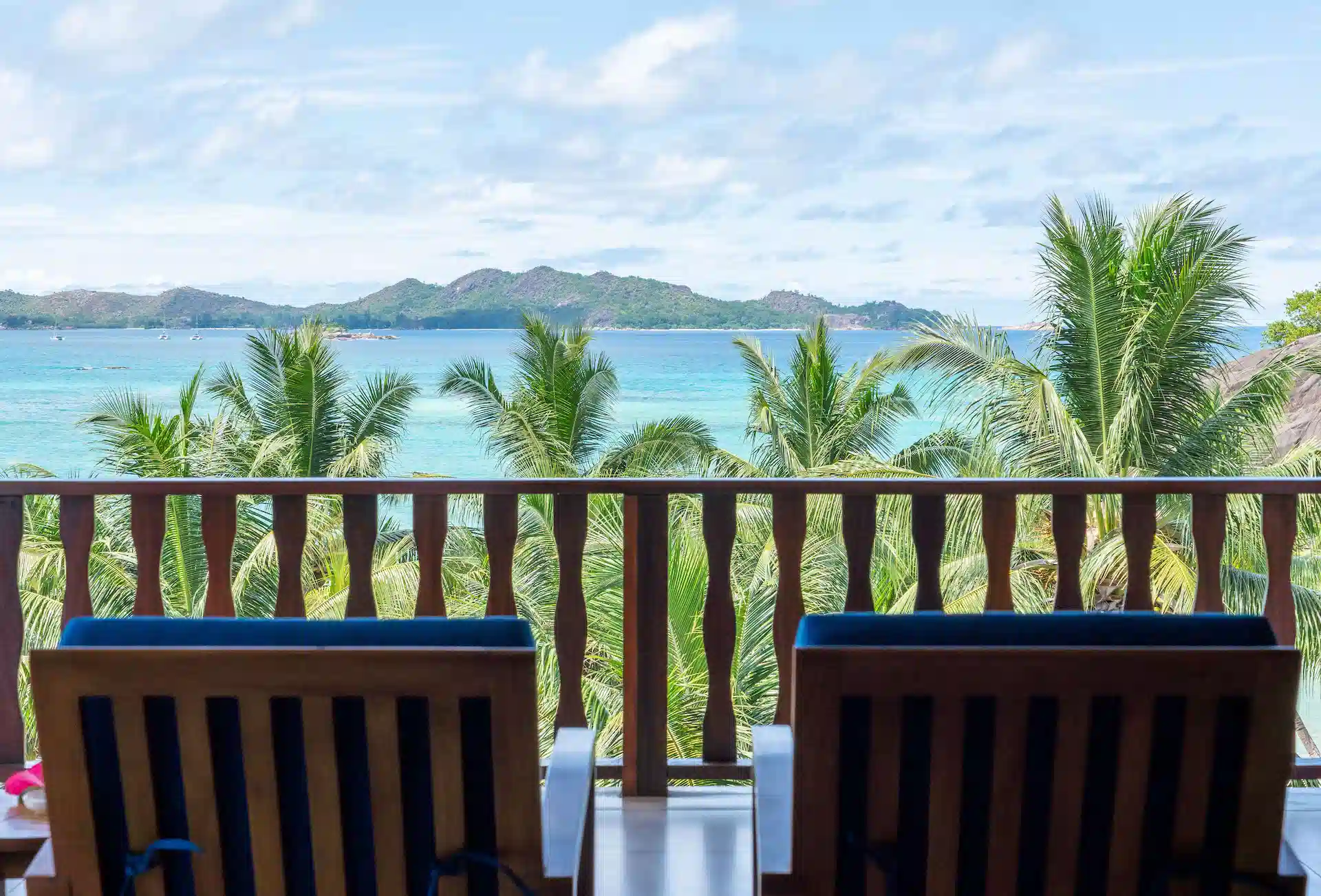 larchipel seychelles family suite balcony with chairs and tropical ocean view