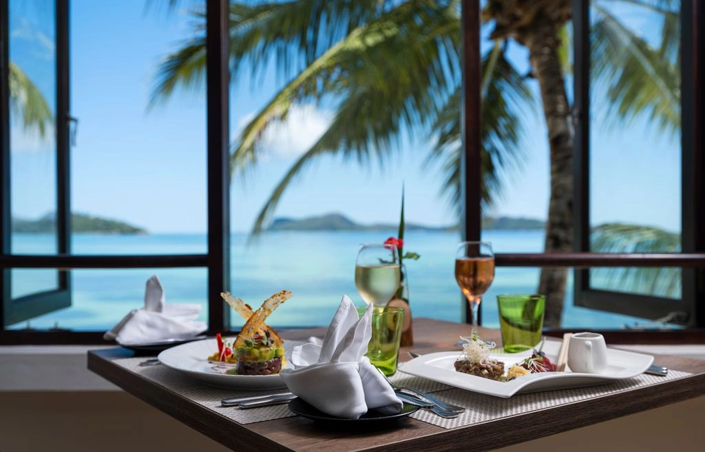 larchipel seychelles restaurant la feuille dor fine dining with elegant indoor seating and tropical surroundings