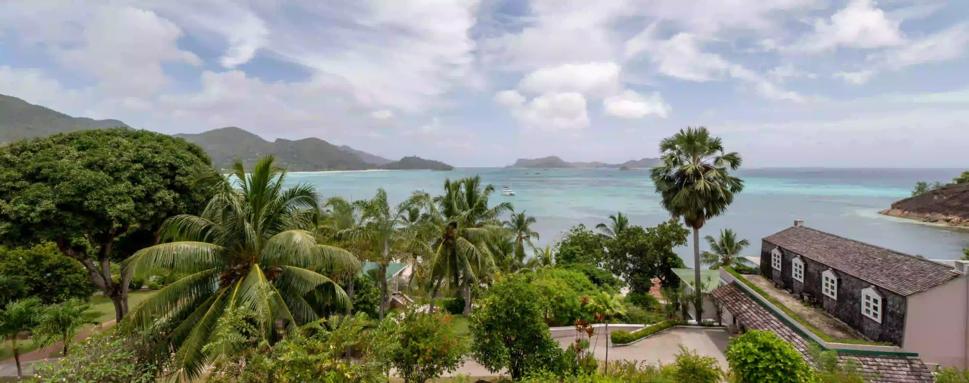 larchipel seychelles senior suite with balcony view of turquoise waters