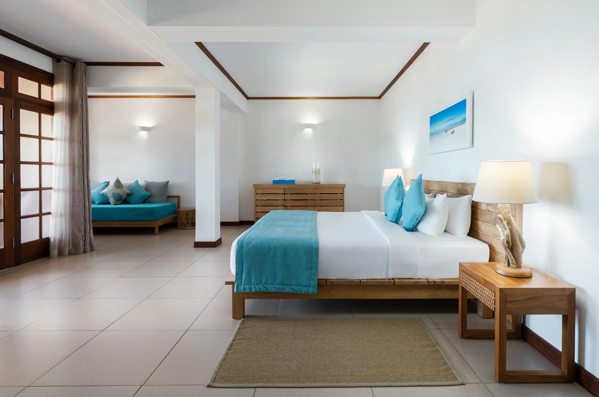 larchipel seychelles superior room side view of bed with tropical decor