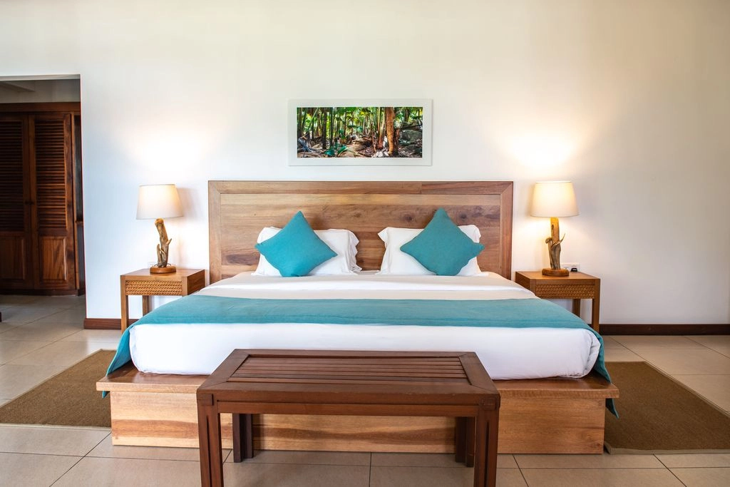 larchipel seychelles superior room bedroom with king bed