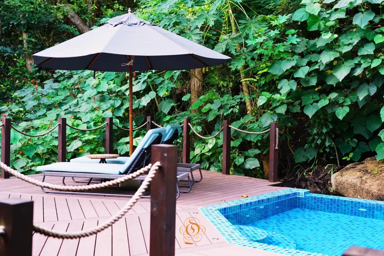 private pool of a pool villa at Le Domaine de L’Orangeraie Resort & Spa surrounded by tropical greenery with a secluded outdoor setting
