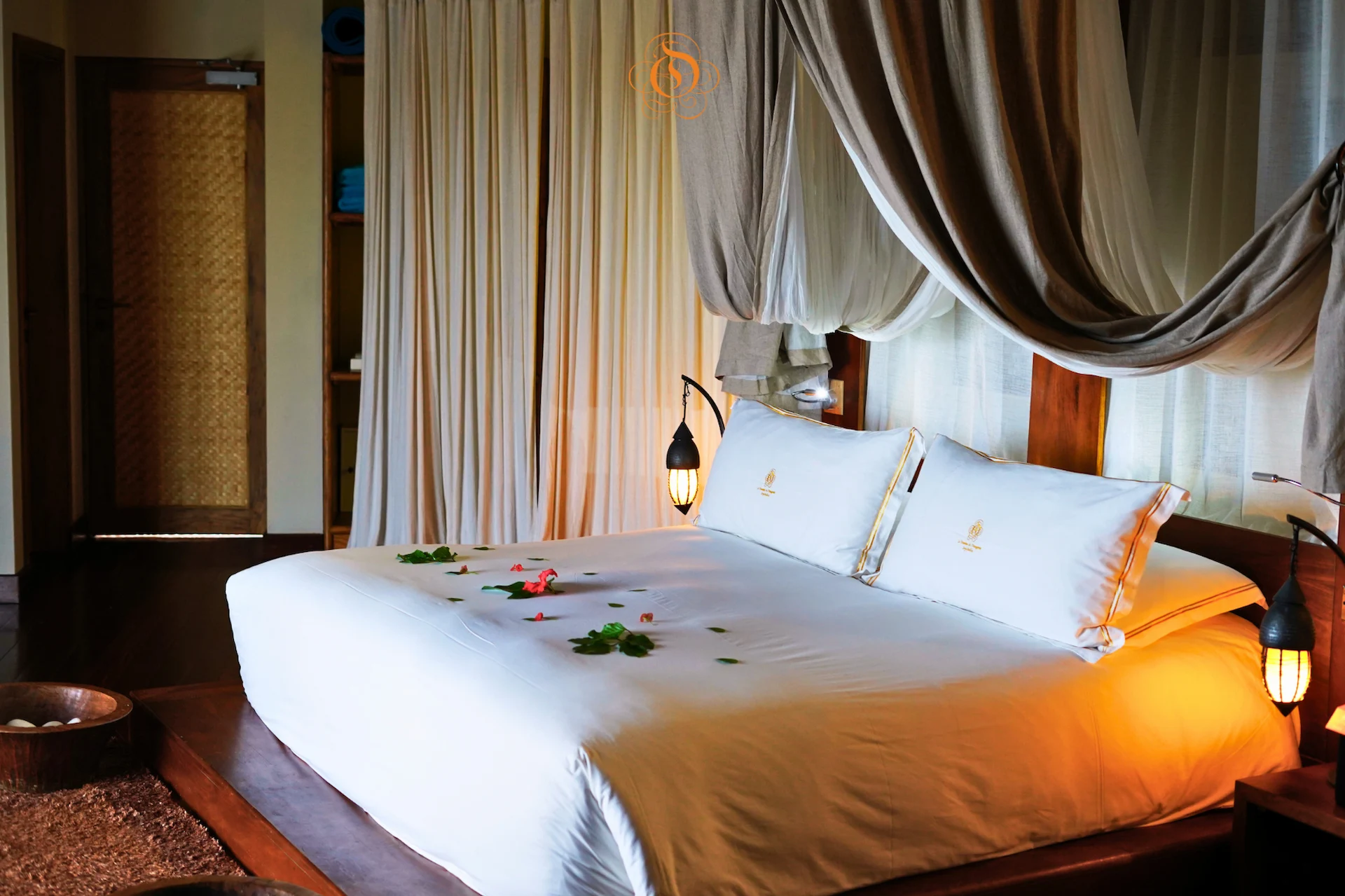 bedroom in a presidential villa at Le Domaine de L’Orangeraie Resort & Spa featuring a large bed and elegant tropical decor with spacious interiors