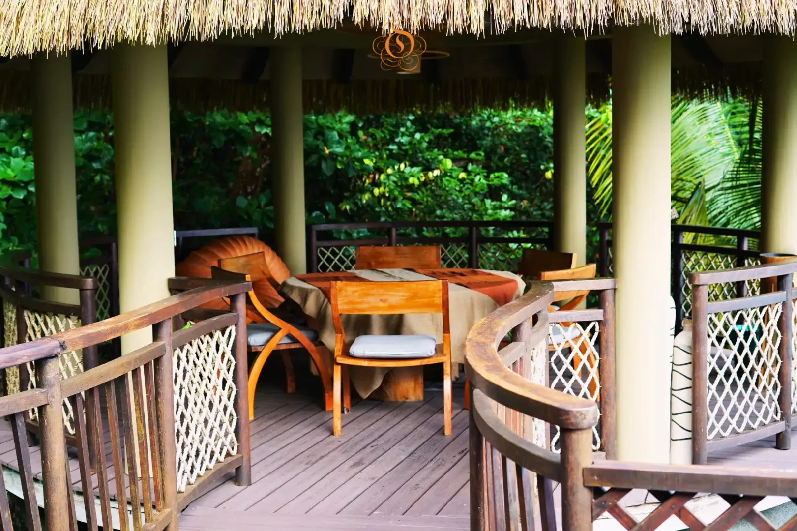 exterior view of a presidential villa at Le Domaine de L’Orangeraie Resort & Spa surrounded by lush tropical gardens and island scenery