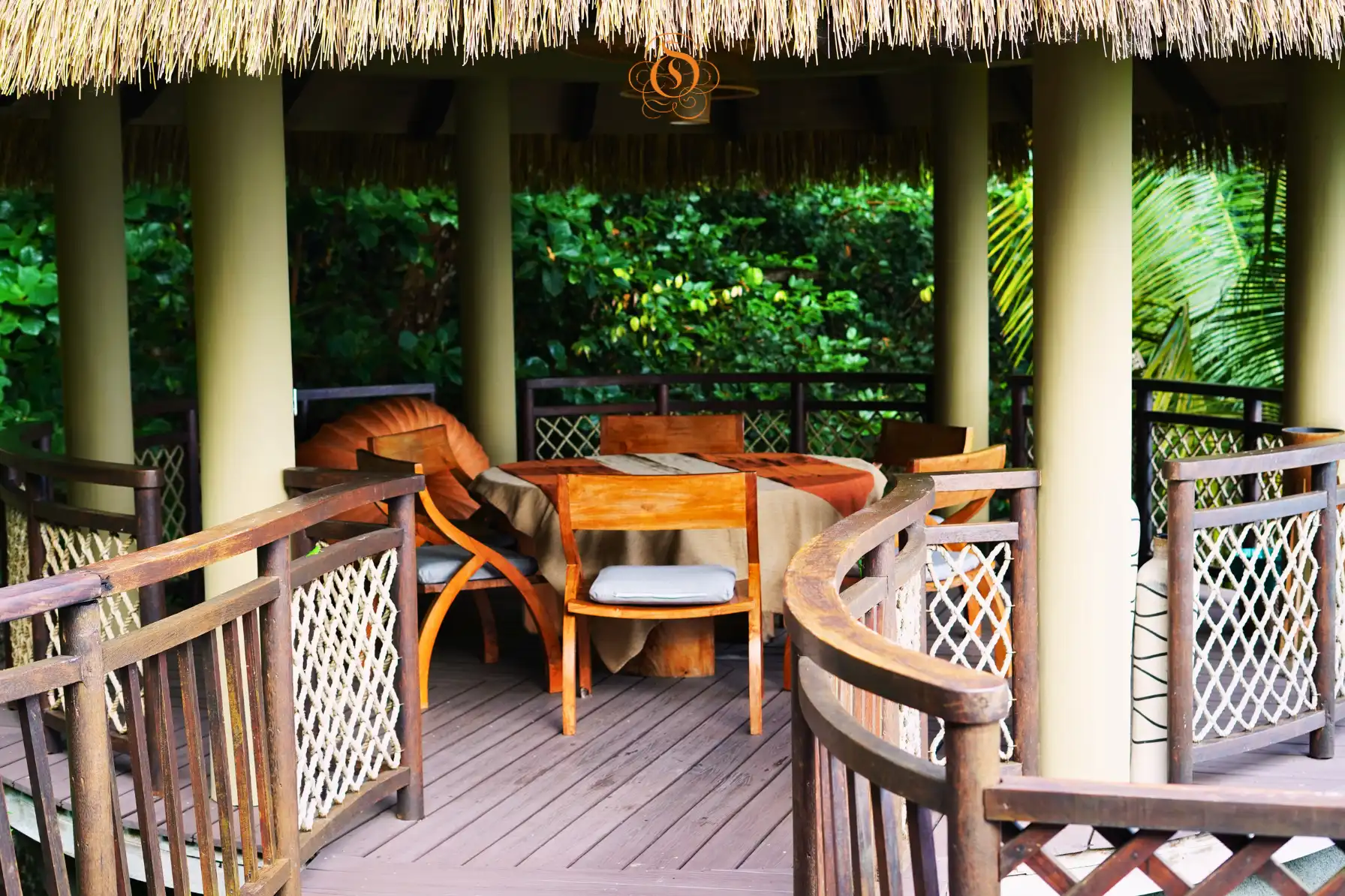 exterior view of a presidential villa at Le Domaine de L’Orangeraie Resort & Spa surrounded by lush tropical gardens and island scenery