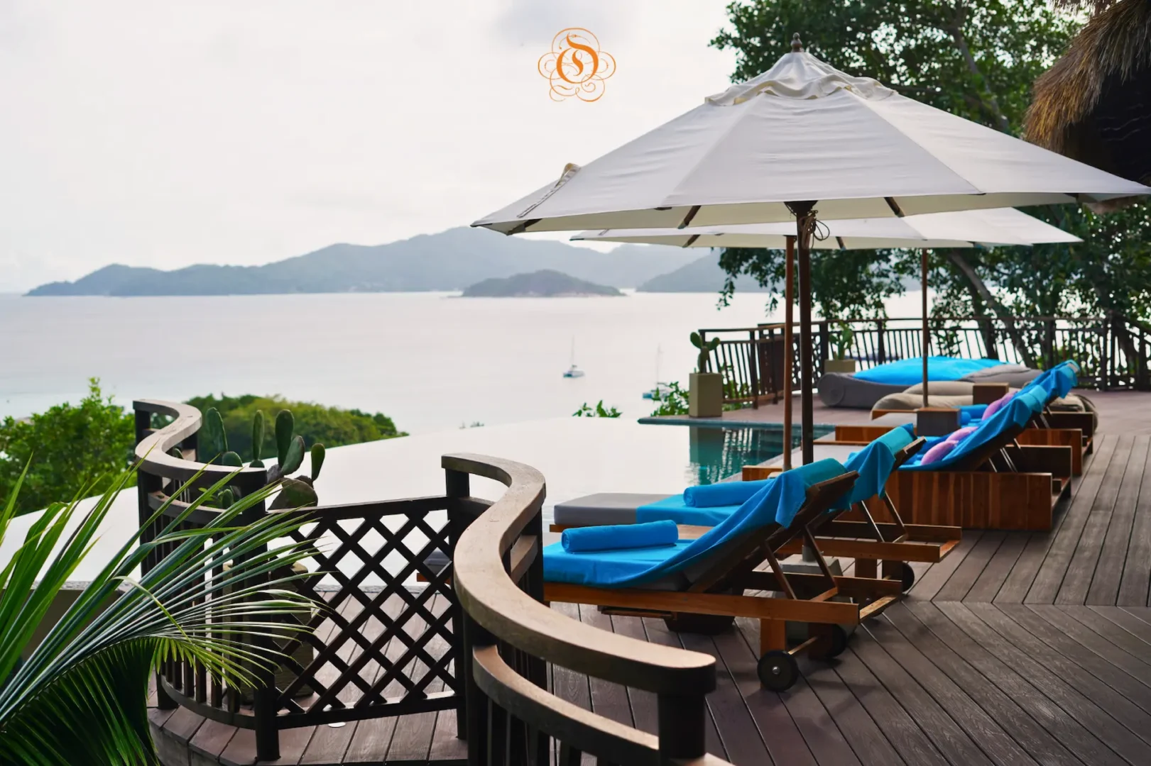 pool area with loungers at a presidential villa at Le Domaine de L’Orangeraie Resort & Spa surrounded by tropical greenery and a private outdoor setting