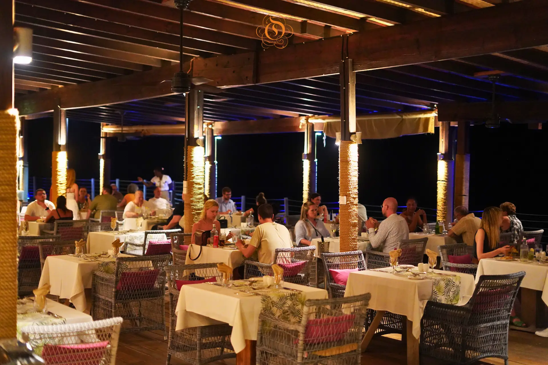 santosha restaurant at Le Domaine de L’Orangeraie Resort & Spa with open air dining space, tropical decor, and a relaxed island atmosphere