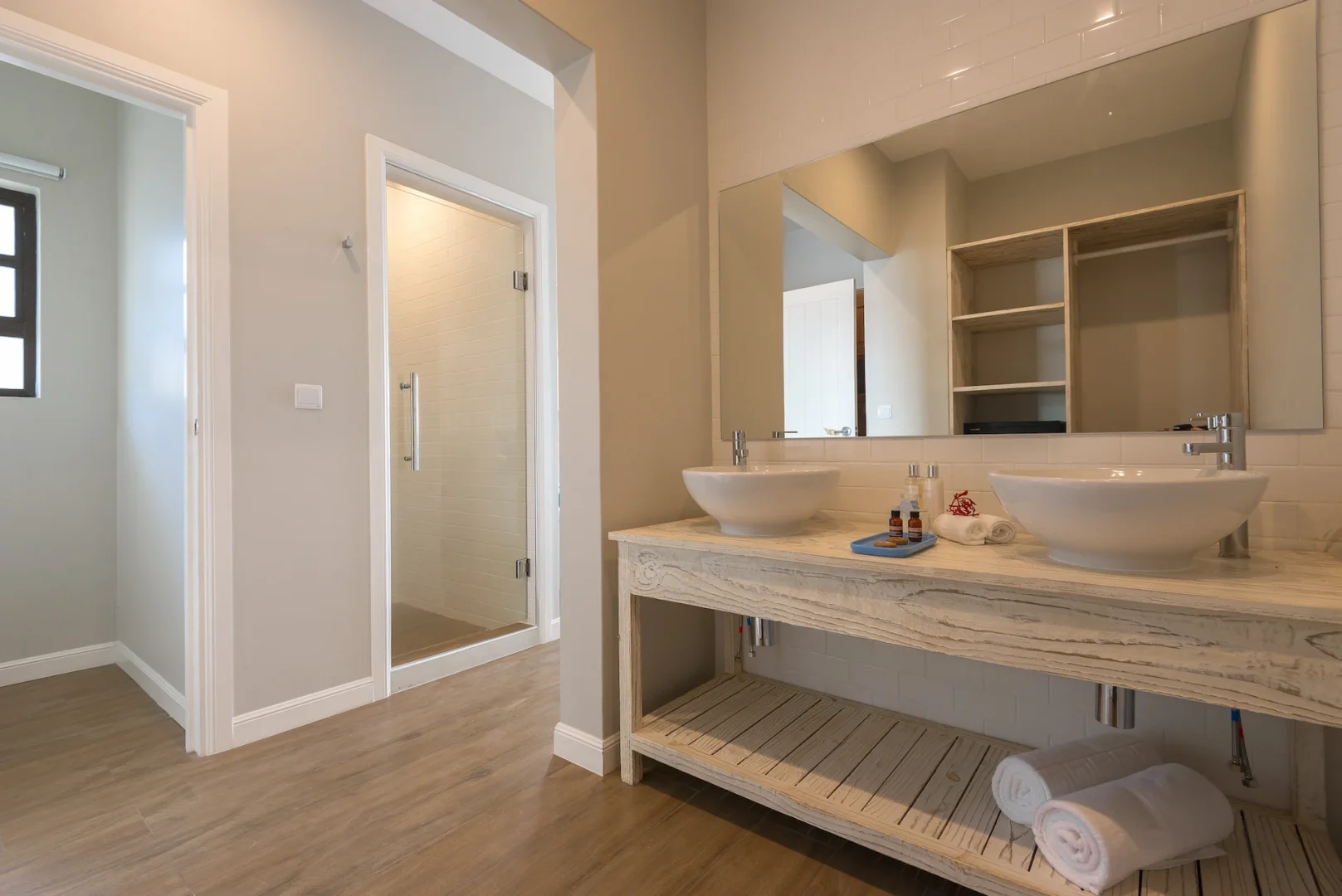 bathroom at Le Nautique with simple modern fixtures and clean design in a tropical setting