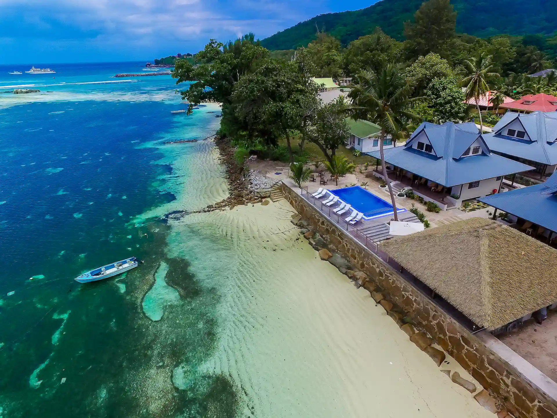 beach at Le Nautique with white sand, turquoise waters, and a relaxed tropical setting