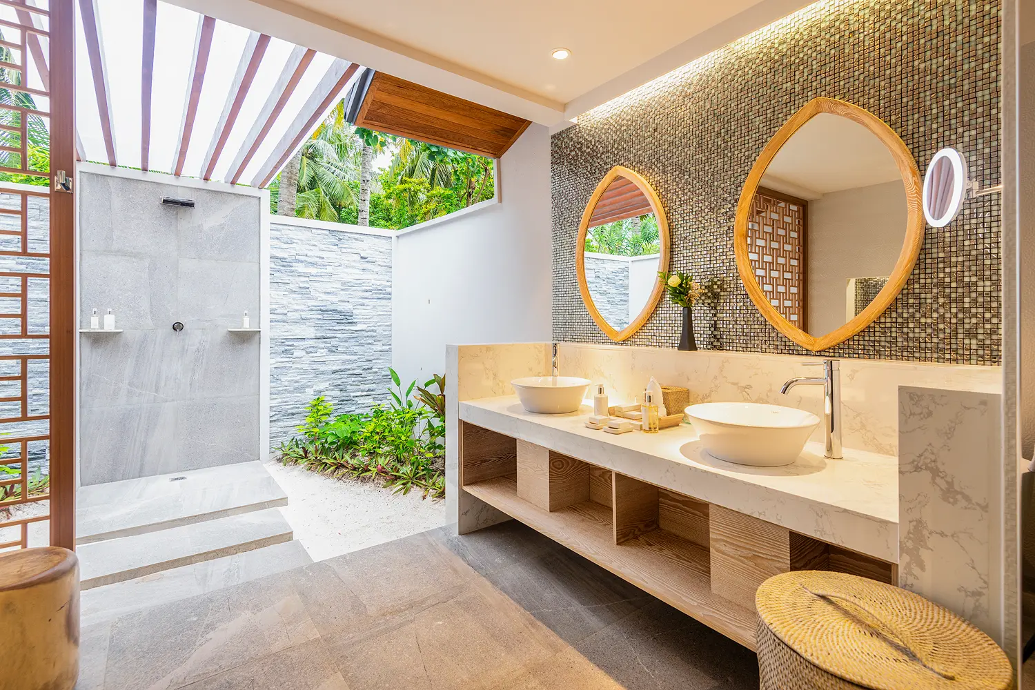 lily beach maldives beach family villas double sink bathroom featuring elegant modern finishes with soft natural lighting and a serene spacious tropical ambience