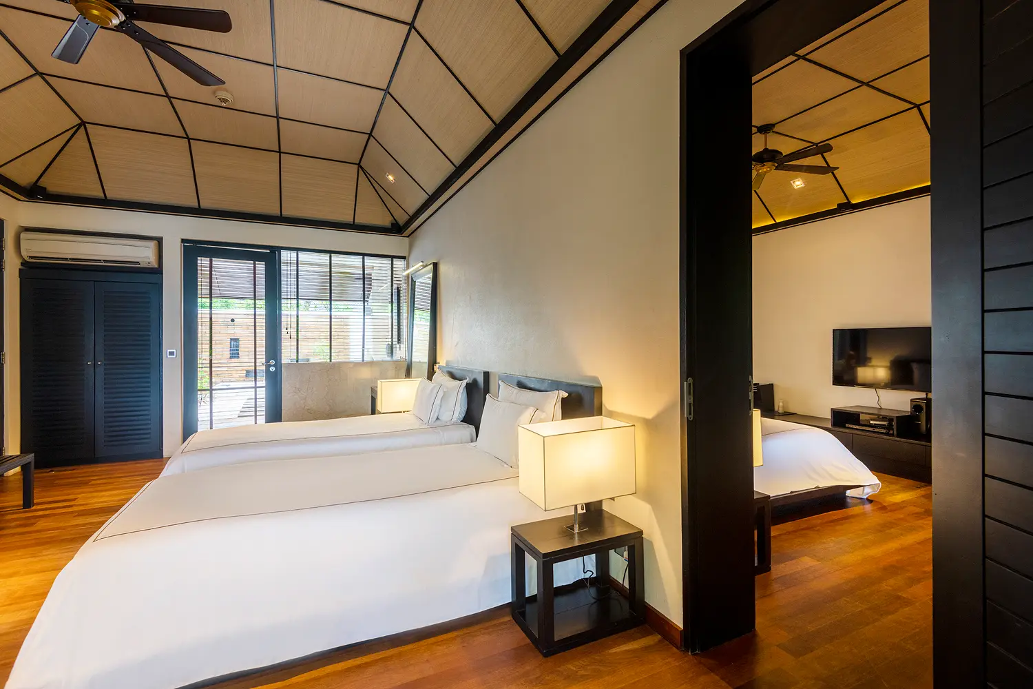lily beach maldives beach family villas twin beds with soft natural light and a serene spacious tropical ambience perfect for families