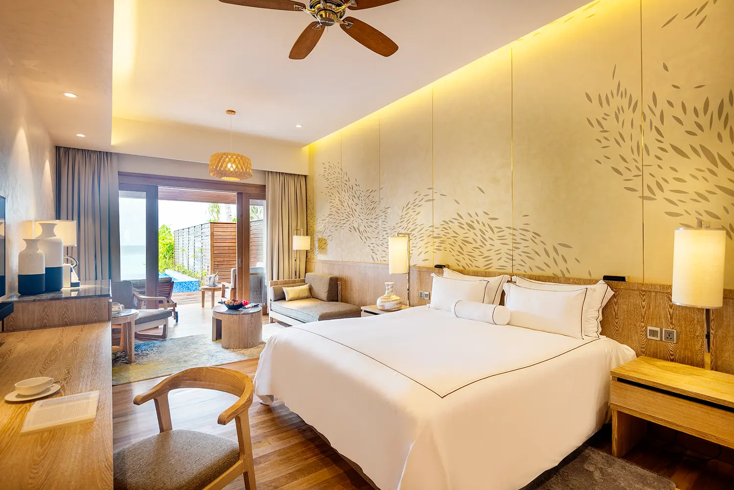 lily beach maldives beach suite bedroom interior featuring elegant tropical design soft natural lighting and a serene spacious ambience