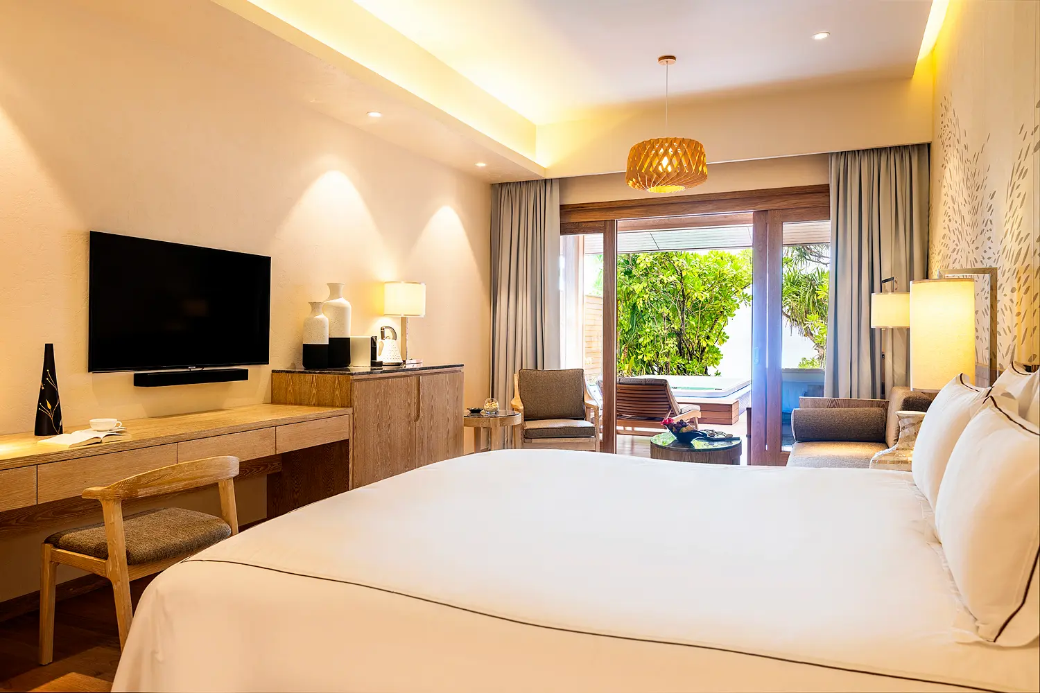 lily beach maldives beach suite with pool jacuzzi bedroom interior featuring elegant tropical design soft natural lighting and a serene spacious ambience