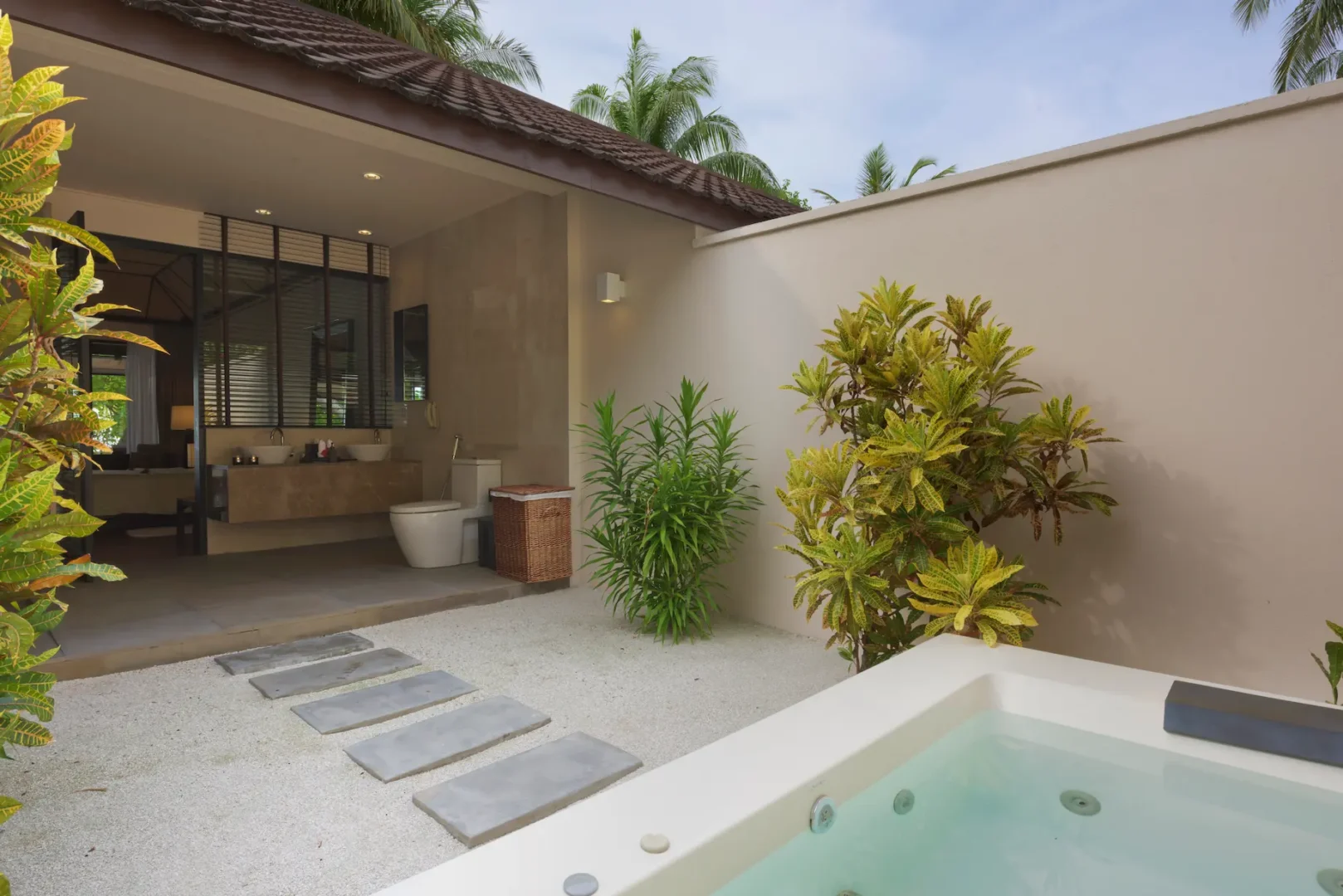 lily beach maldives beach villa bathroom with elegant tropical design soft natural lighting and a serene open airy ambience