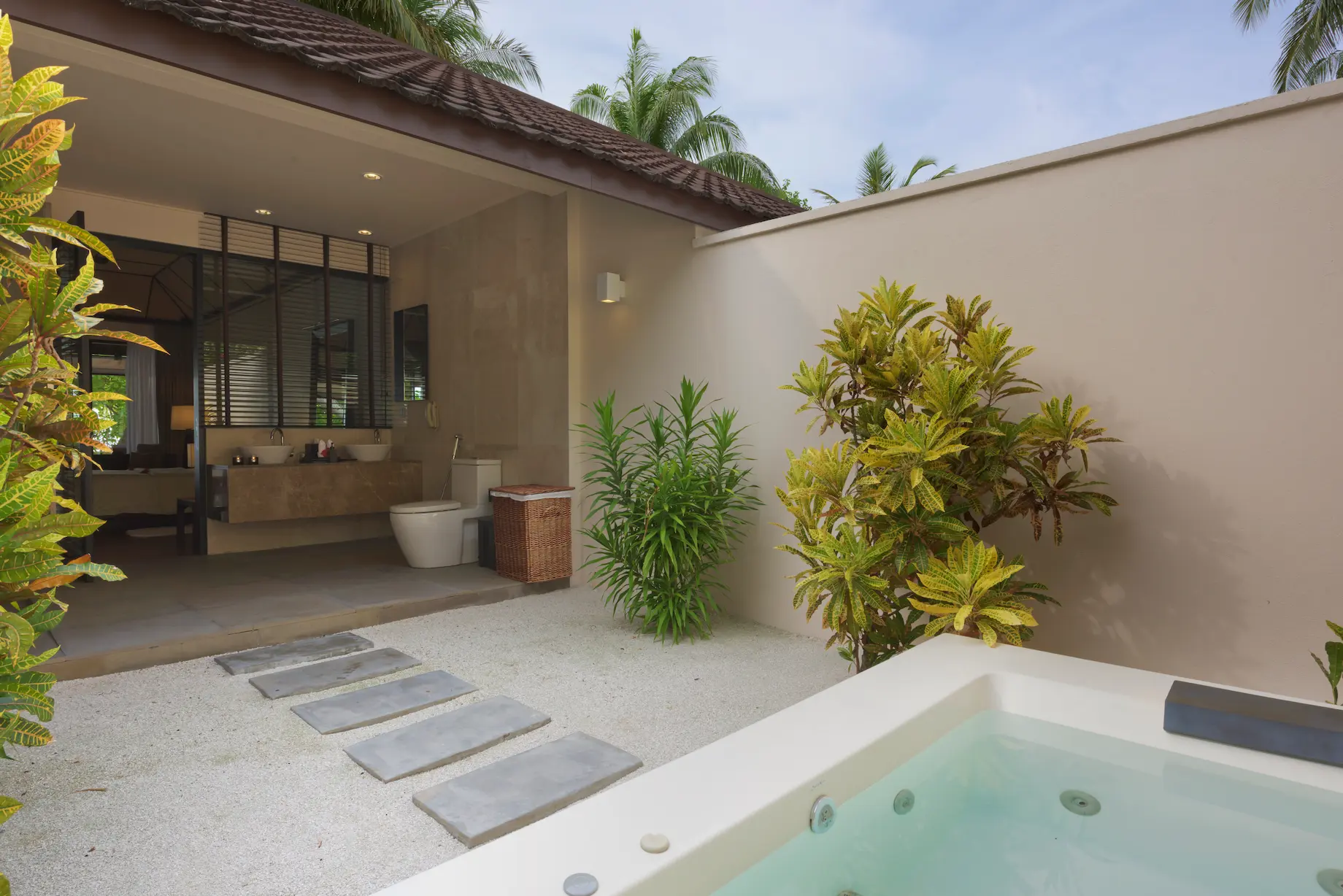 lily beach maldives beach villa bathroom with elegant tropical design soft natural lighting and a serene open airy ambience