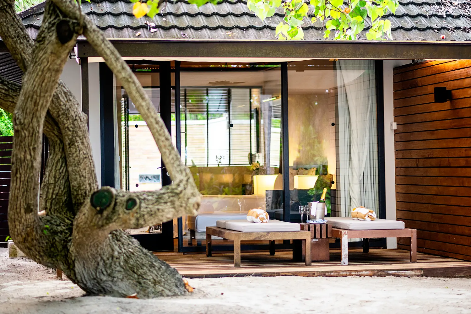 lily beach maldives beach villa exterior set along the shoreline with elegant tropical architecture and serene ocean views