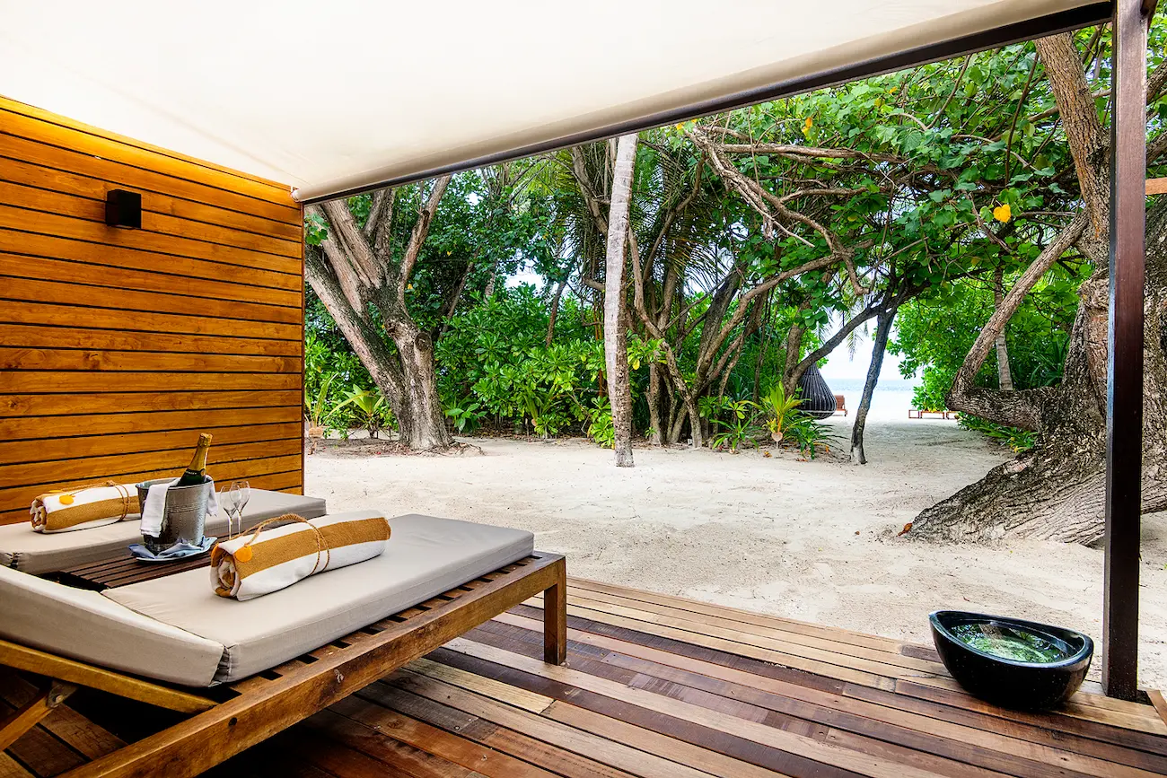 lily beach maldives beach villa terrace view overlooking the shoreline with serene tropical scenery and gentle ocean ambience