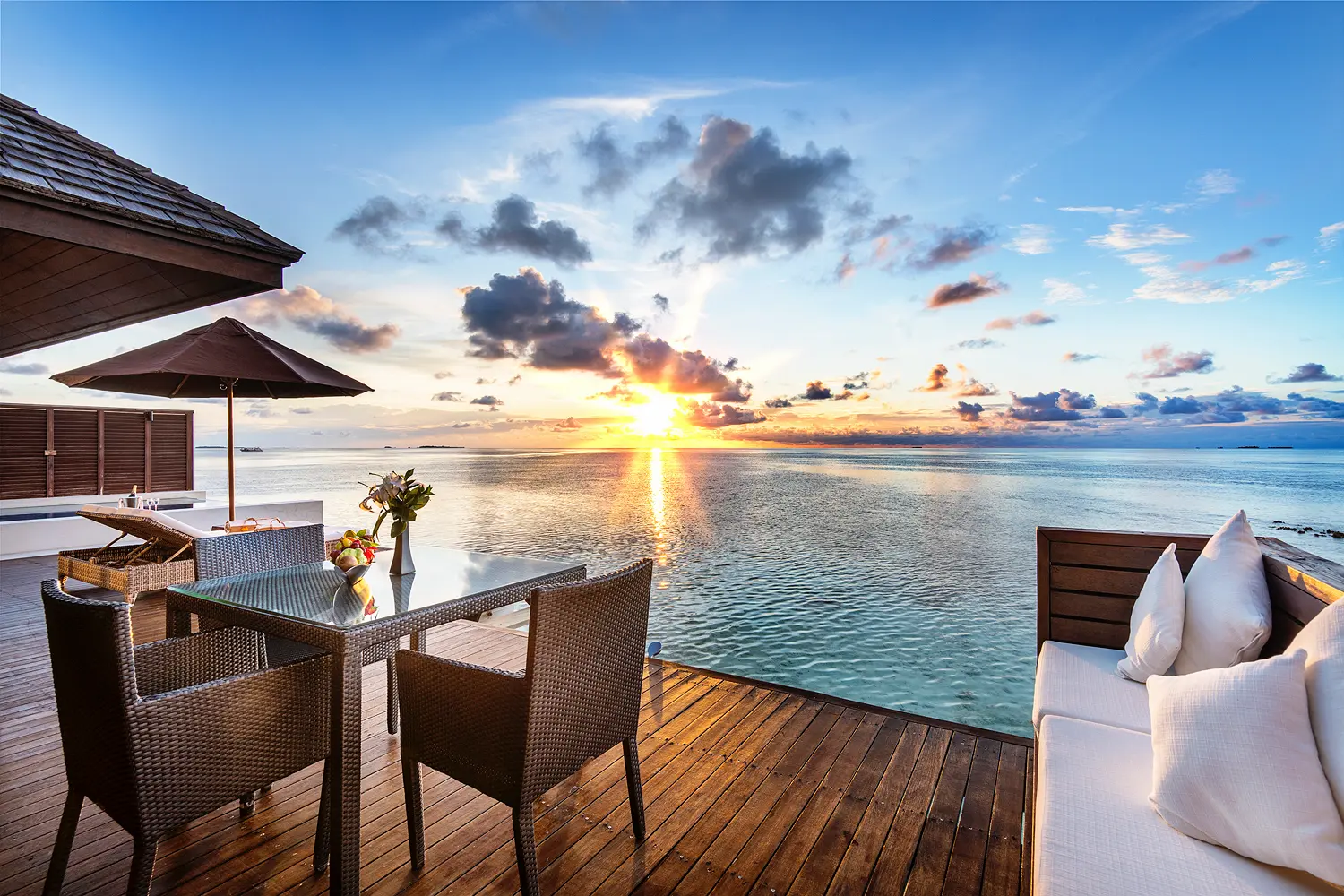 lily beach maldives beach villa terrace overlooking the shoreline with serene tropical ambience and gentle ocean views