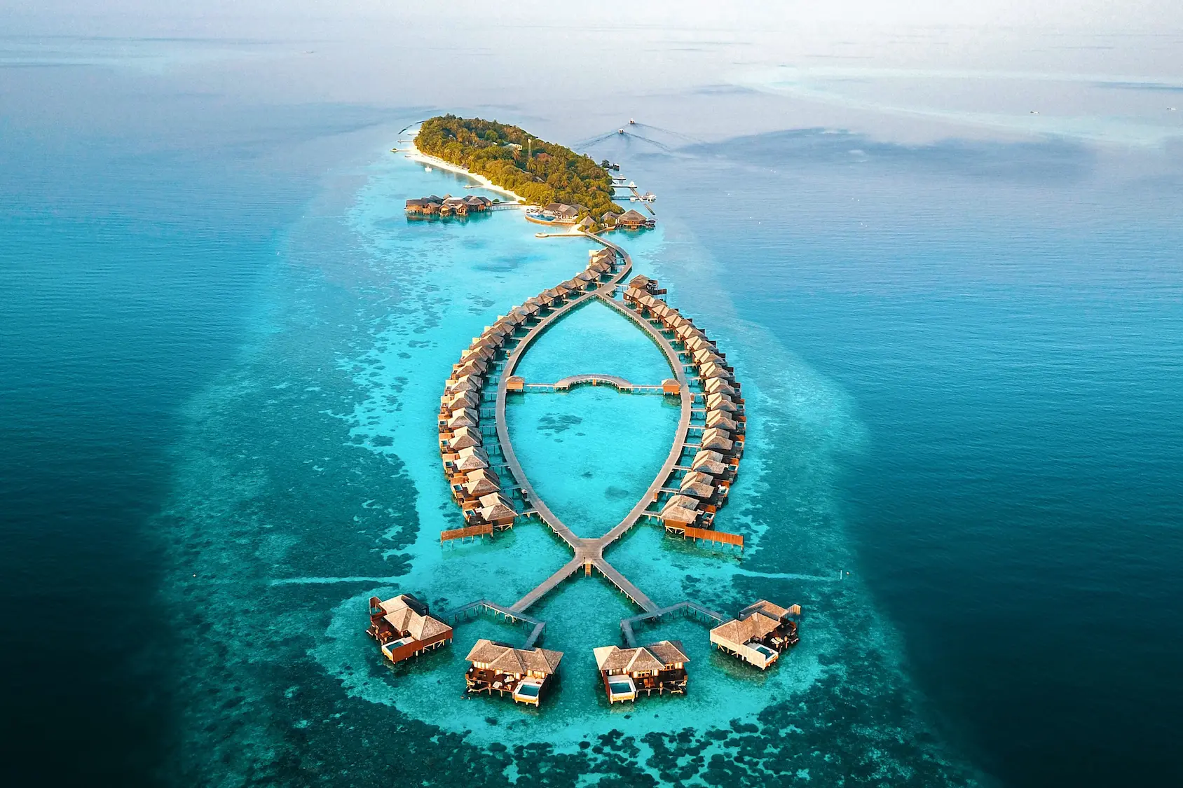 lily beach maldives aerial view showcasing turquoise lagoon and island surroundings