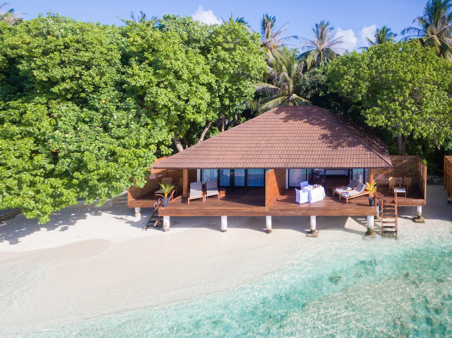 lily beach maldives lagoon villa exterior set along the tranquil lagoon with elegant tropical architecture and serene ocean views