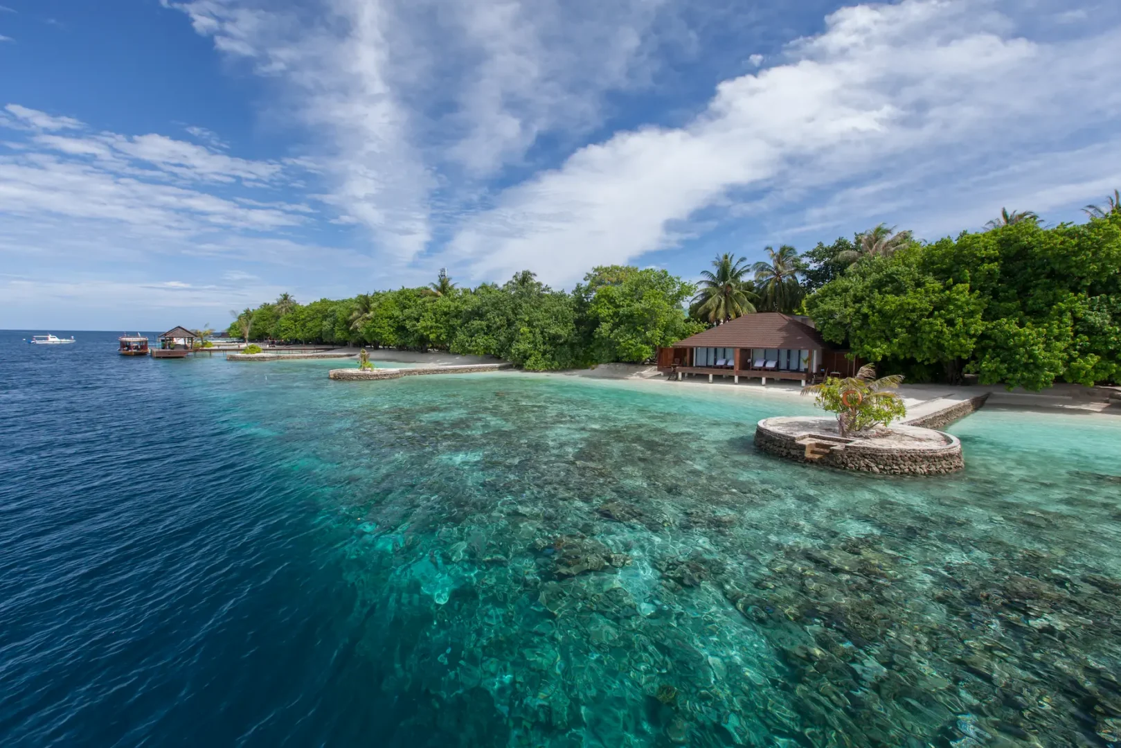 lily beach maldives lagoon villa house reef with vibrant coral gardens and clear turquoise water offering serene underwater views and tropical marine life