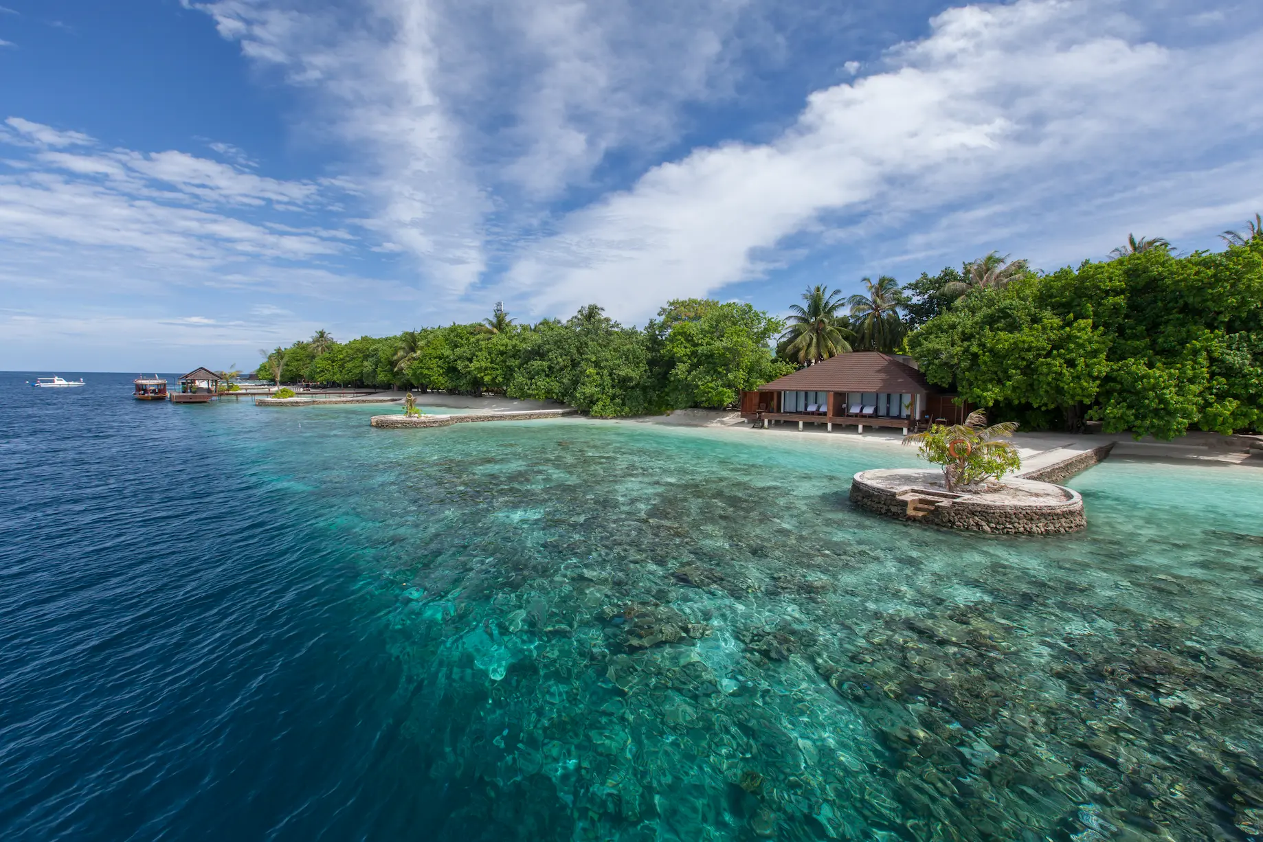 lily beach maldives lagoon villa house reef with vibrant coral gardens and clear turquoise water offering serene underwater views and tropical marine life