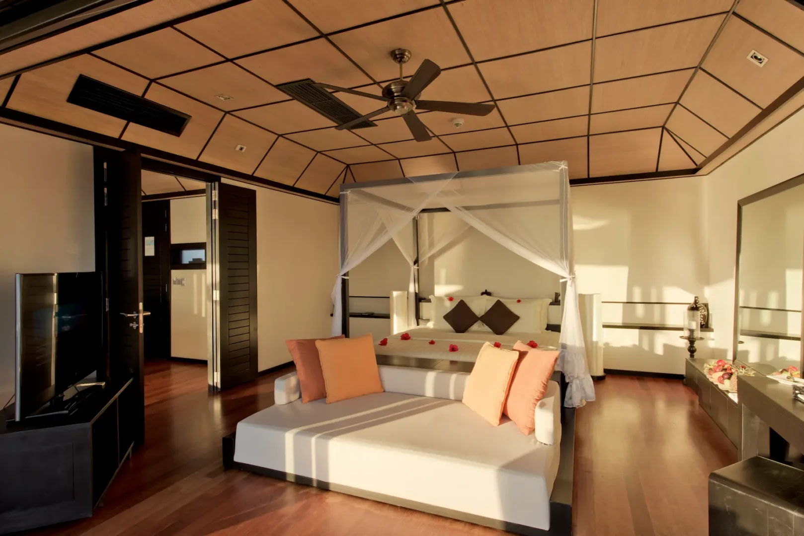 lily beach maldives sunset water suites bedroom interior featuring elegant tropical design soft natural light and serene lagoon inspired ambience