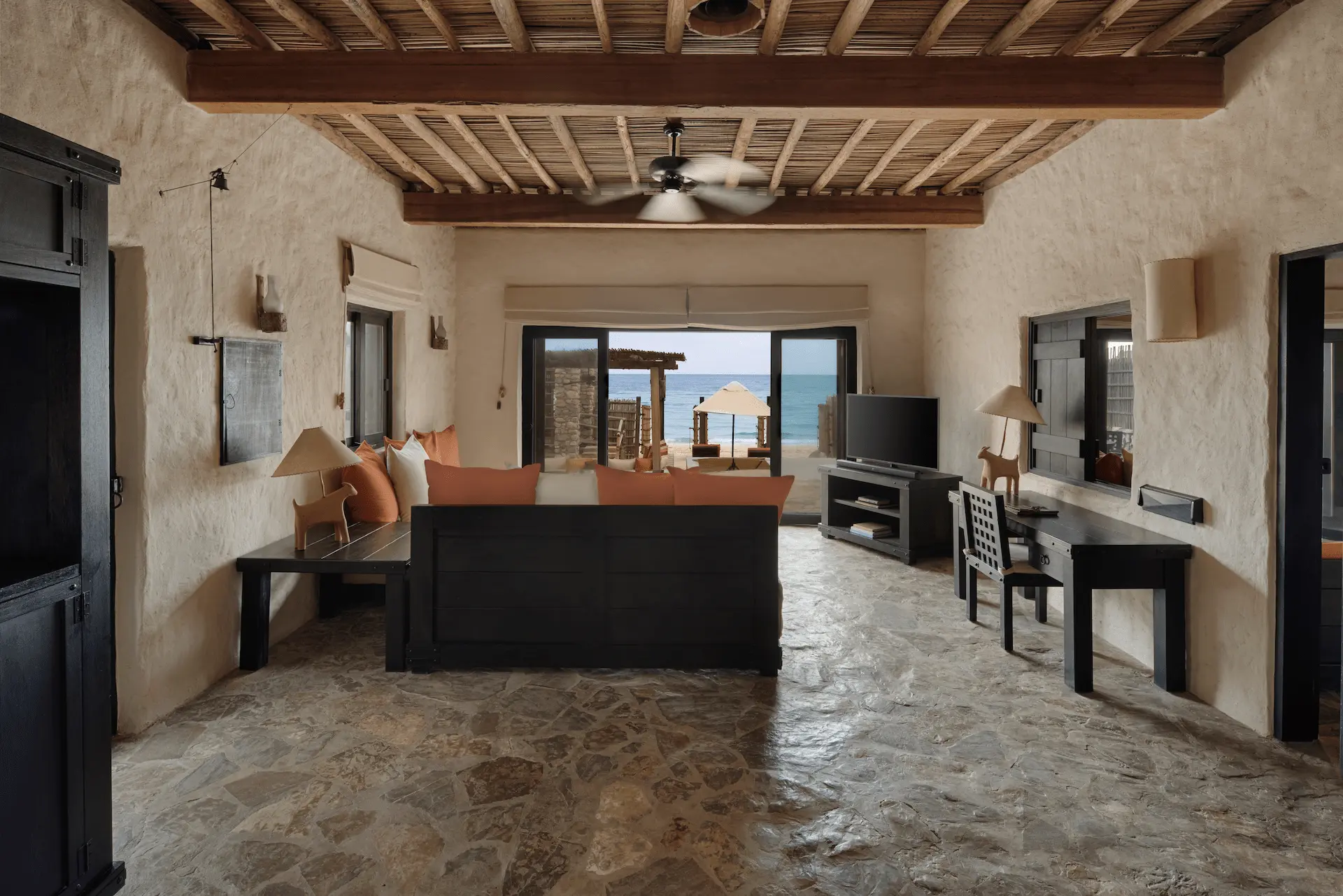 living area in pool villa suite beachfront at six senses zighy bay oman