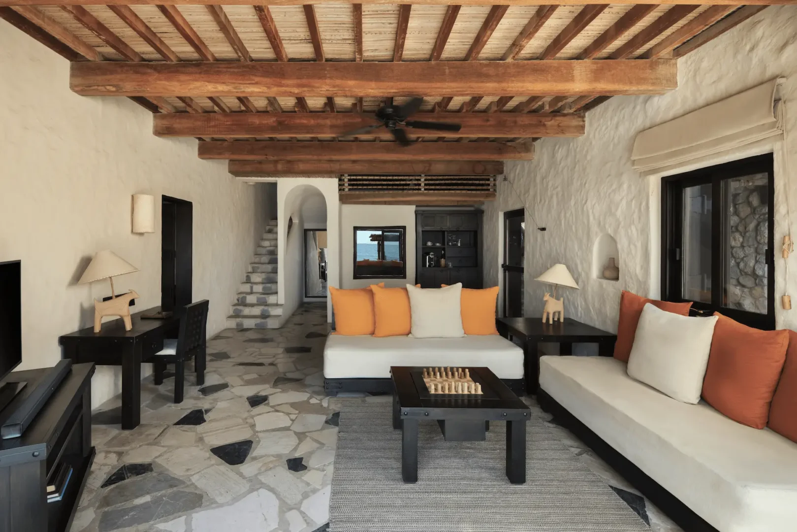 living room in pool villa beachfront at six senses zighy bay oman