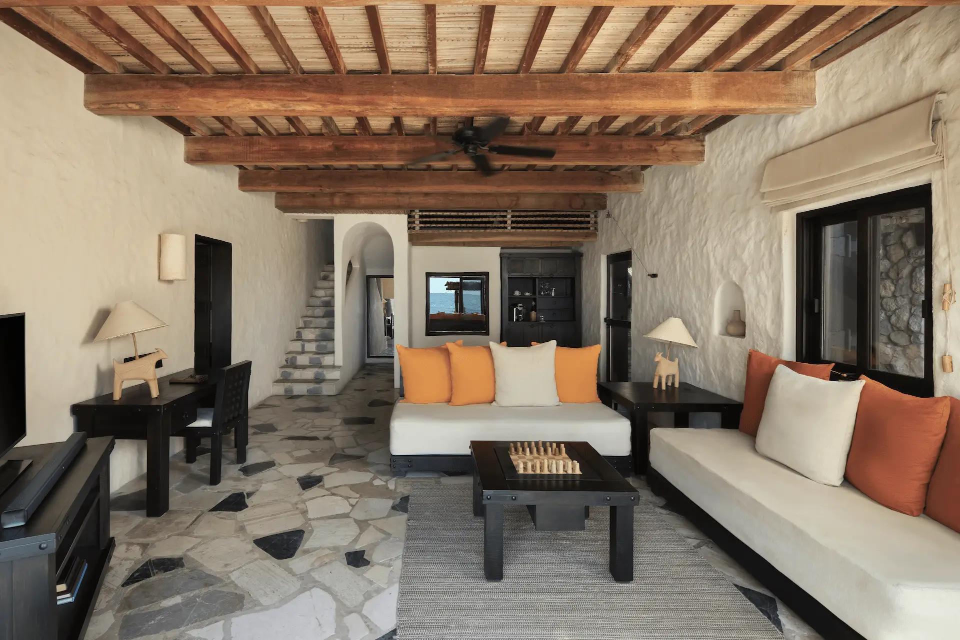 living room in pool villa beachfront at six senses zighy bay oman