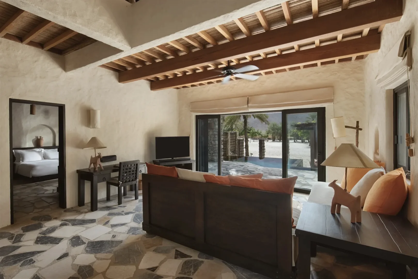 lounge sofa in duplex two bedroom pool villa suite at six senses zighy bay oman