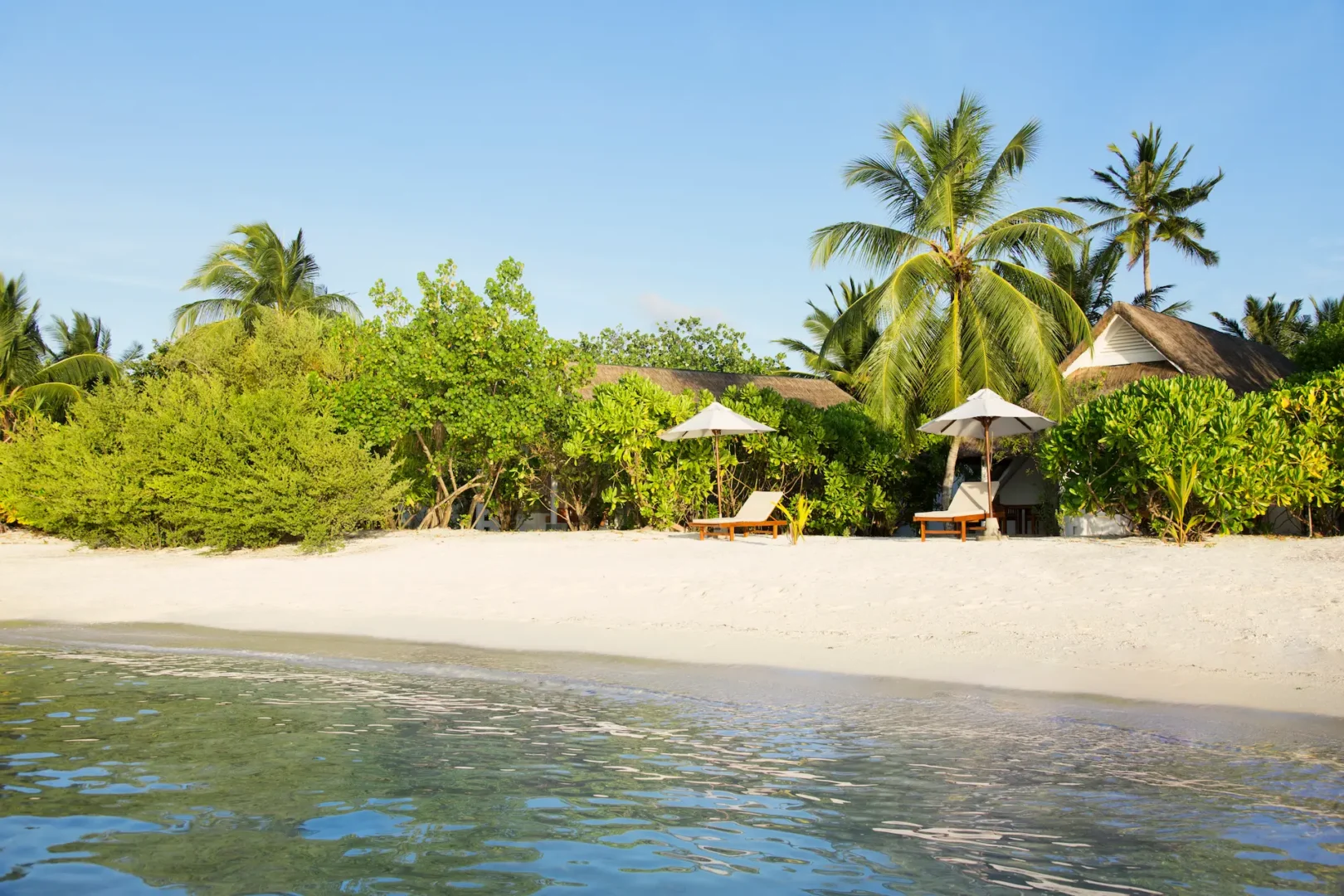 lux south ari atoll beach pavilion exterior with tranquil beachfront setting