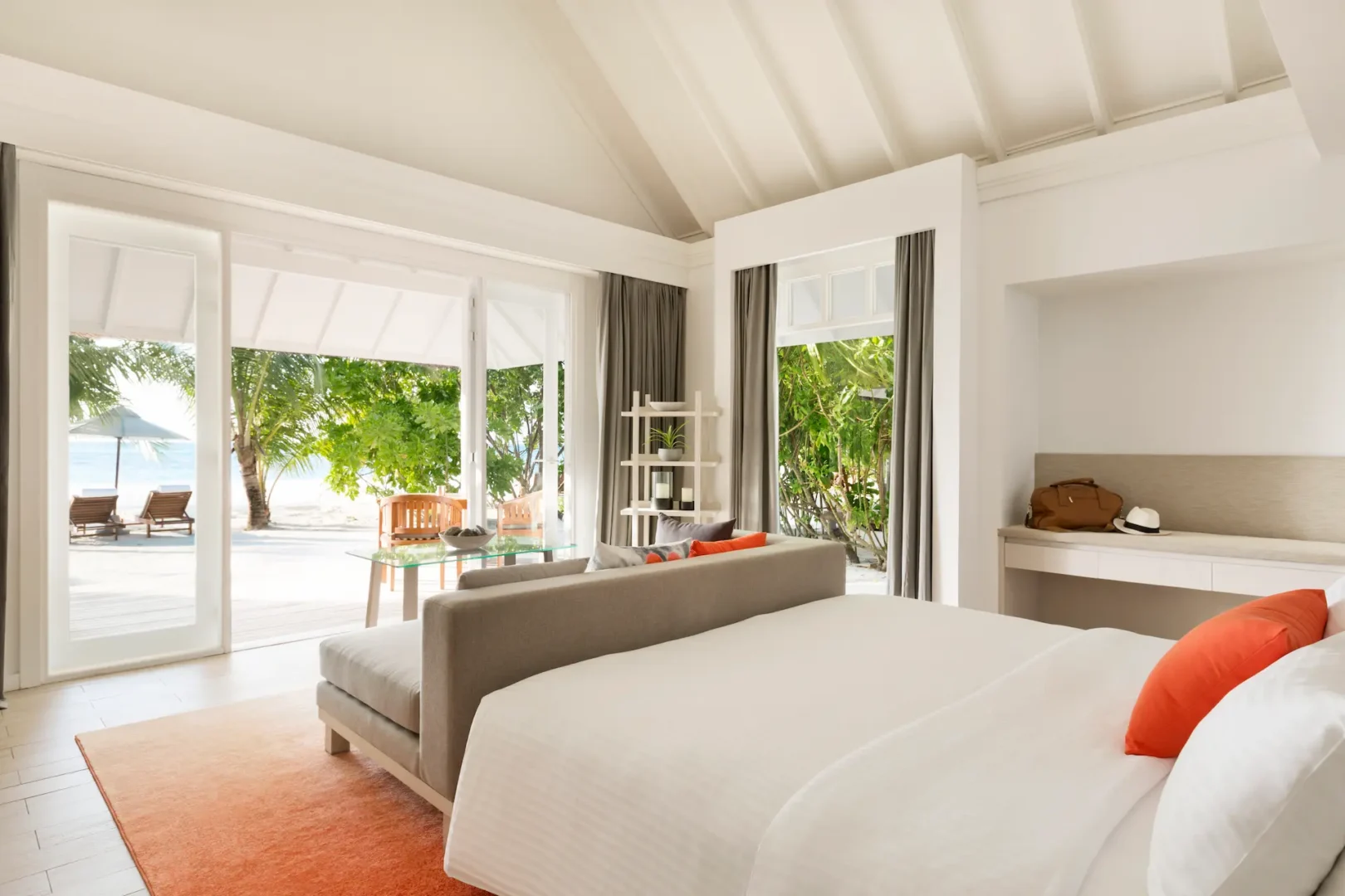 lux south ari atoll beach pool villa bedroom interior with serene island inspired design