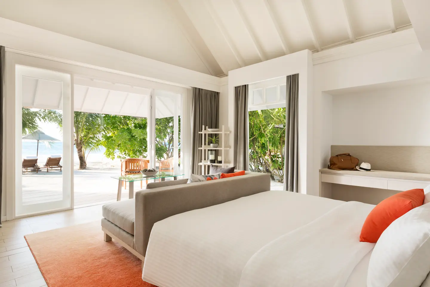 lux south ari atoll beach villa bedroom with view overlooking the tranquil lagoon