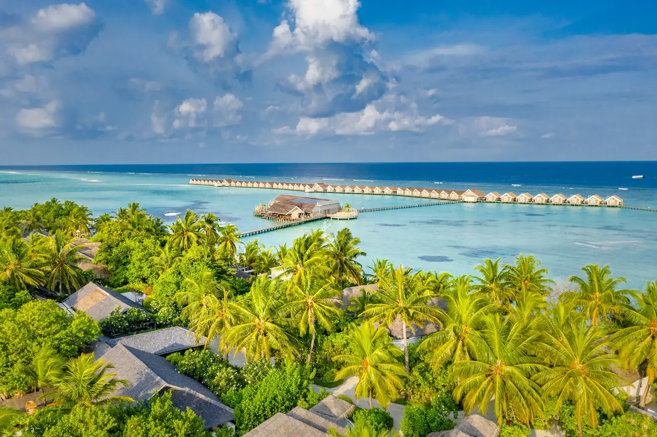 lux south ari atoll maldives aerial resort east view showing expansive lagoon and overwater villas